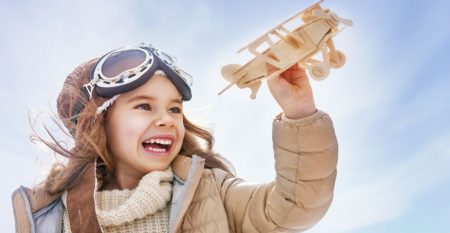 2017People___Children_Little_smiling_girl_with_an_airplane_in_hands_114381_