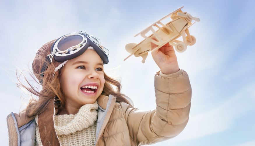 2017People___Children_Little_smiling_girl_with_an_airplane_in_hands_114381_